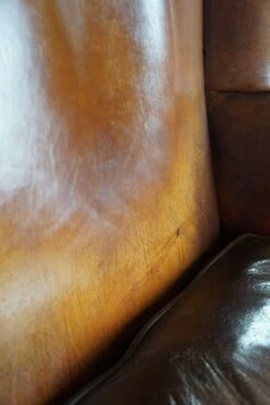 Very Rugged Wingback Armchair Made Of Cognac-colored Sheep Leather Finished With Decorative Nail Hea 14 Very Rugged Wingback Armchair Made Of Cognac-colored Sheep Leather Finished With Decorative Nail Hea -Chairly Shop 0b09b75c d8be 4d31 95d0 ae4040e1b154