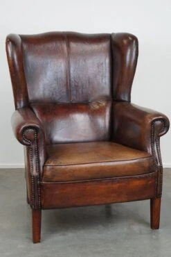 Large Sheepskin Leather Wingback Armchair With A Fixed Seat Cushion And A Stunning Patina -Chairly Shop 1008158c ea01 49a7 9659 72ffaf956136