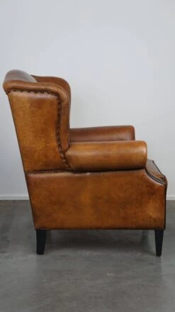 Beautiful Sheepskin Leather Wingback Armchair, With Nails And Black Piping -Chairly Shop 38d55520 73a6 4b9d 86d5 bad820df04a2