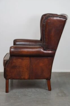 Large Sheepskin Leather Wingback Armchair With A Fixed Seat Cushion And A Stunning Patina -Chairly Shop 39d37022 6aa1 469d a413 c97a4842611c