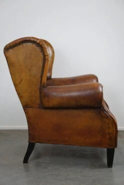 Irresistible Old Sheep Leather Wingback Armchair With The Most Beautiful Colors -Chairly Shop 4b38fb2a 1222 454a b9b0 48a50ba21956