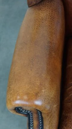 Beautiful Sheepskin Leather Wingback Armchair, With Nails And Black Piping -Chairly Shop 51b0f718 b7dd 4c0a 8f38 452e0dc856ec