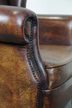 Large Sheepskin Leather Wingback Armchair With A Fixed Seat Cushion And A Stunning Patina -Chairly Shop 5344b5d3 2552 4348 8bdc 16c49251675a