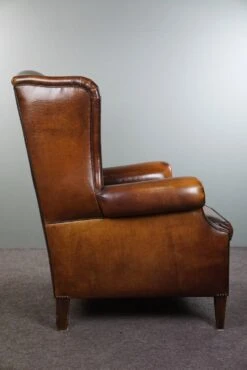 Luxurious Large Sheep Leather Wingback Armchair With Beautiful Colors And Amazing Patina 22 Luxurious Large Sheep Leather Wingback Armchair With Beautiful Colors And Amazing Patina -Chairly Shop 5b08350d ea3c 4a42 b673 7f3dd109d2d7
