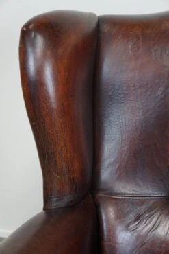 Large Sheepskin Leather Wingback Armchair With A Fixed Seat Cushion And A Stunning Patina -Chairly Shop 66009d28 fd59 48eb a94b f9267c1a61ea