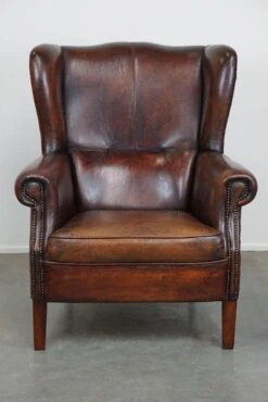 Large Sheepskin Leather Wingback Armchair With A Fixed Seat Cushion And A Stunning Patina -Chairly Shop 6cc53b5b 8092 4a49 80da 4d461aafb3ca