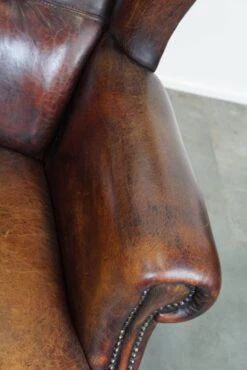 Large Sheepskin Leather Wingback Armchair With A Fixed Seat Cushion And A Stunning Patina -Chairly Shop 8d386412 cc61 4e1c bf24 9ee85cc873ab