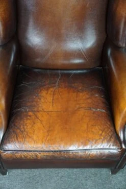 Luxurious Large Sheep Leather Wingback Armchair With Beautiful Colors And Amazing Patina 21 Luxurious Large Sheep Leather Wingback Armchair With Beautiful Colors And Amazing Patina -Chairly Shop a2c5ff6f c824 433c b5fa 901a05c69fcb