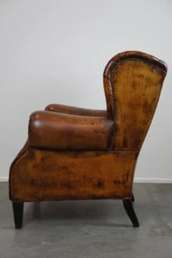 Irresistible Old Sheep Leather Wingback Armchair With The Most Beautiful Colors -Chairly Shop a7e40cd9 3fed 41dc 9f03 e0cff476fd6b