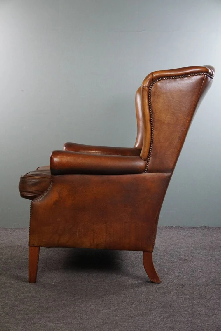 Very Rugged Wingback Armchair Made Of Cognac-colored Sheep Leather Finished With Decorative Nail Hea 10 Very Rugged Wingback Armchair Made Of Cognac-colored Sheep Leather Finished With Decorative Nail Hea - Image 8