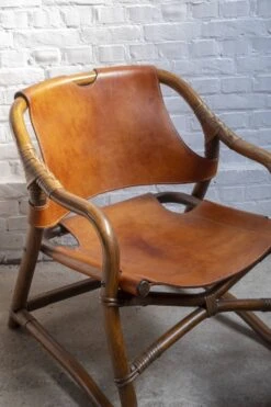 2x Horsnæs "Manilla" Lounge Chairs In Stained Bamboo And Saddle Leather, 1960s Denmark