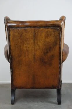 Irresistible Old Sheep Leather Wingback Armchair With The Most Beautiful Colors -Chairly Shop b9e70ebd a842 4201 8792 fb8585f7db1b