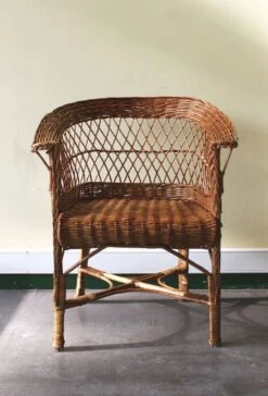 Woven Rattan Armchair With Armrests.