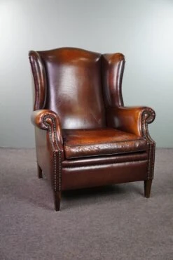 Luxurious Large Sheep Leather Wingback Armchair With Beautiful Colors And Amazing Patina 16 Luxurious Large Sheep Leather Wingback Armchair With Beautiful Colors And Amazing Patina -Chairly Shop da73c3cf 2115 4874 971a 60d31264cbb4