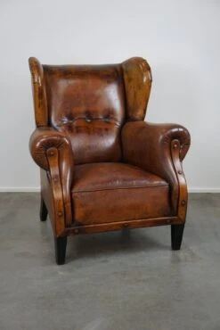 Irresistible Old Sheep Leather Wingback Armchair With The Most Beautiful Colors -Chairly Shop f2e7c08e 0786 4ebe bbd7 8ba79119746c