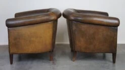 Set Of Two Large, Rugged, Dark Sheepskin Leather Club Armchairs