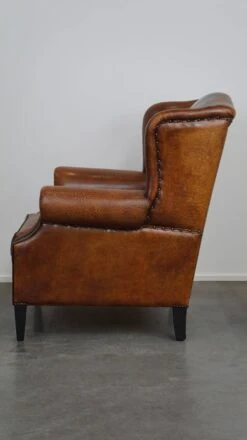 Beautiful Sheepskin Leather Wingback Armchair, With Nails And Black Piping -Chairly Shop ffd5f6d2 1ff3 497a b7fd adf0a0d785a6